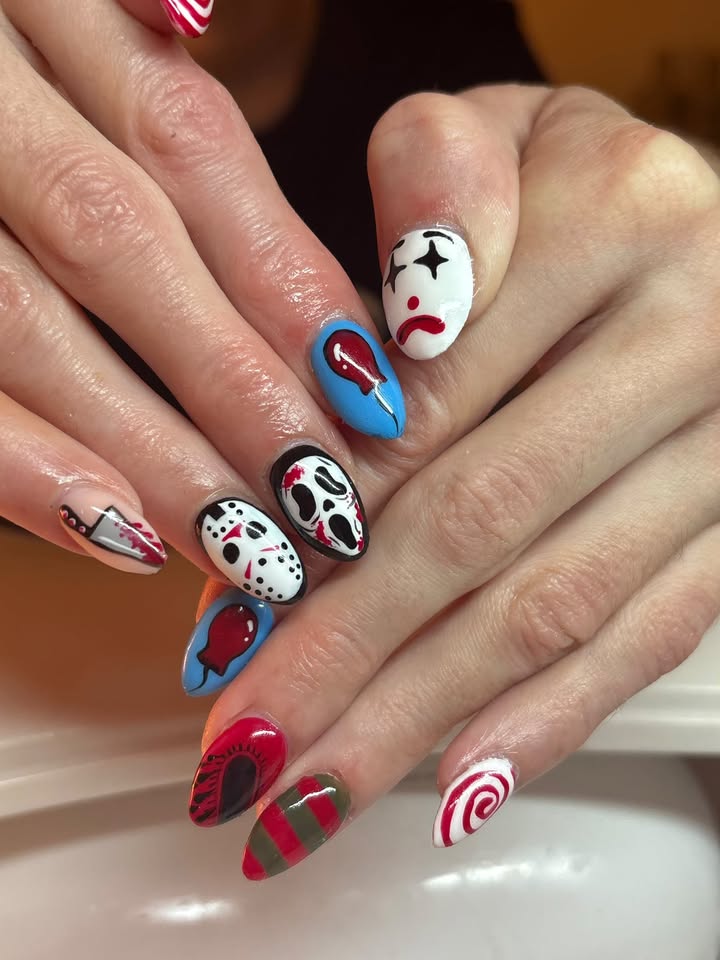 Halloween nail art set with hand-painted horror designs on almond nails